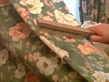 Pre-clean brushing of curtain fabric in Exeter Caption: