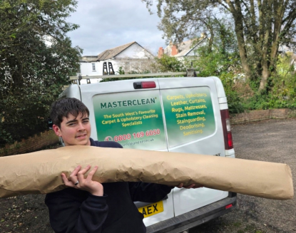 Professionally cleaned rug wrapped and prepared for safe delivery in Exeter