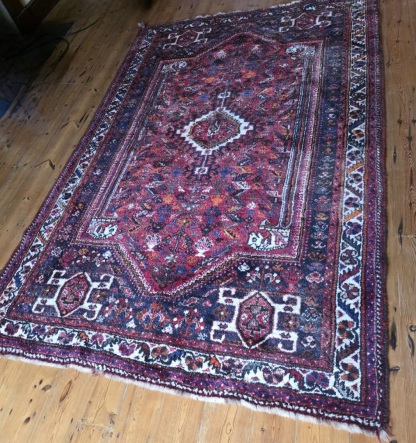 Persuan rug before cleaning at the Masterclean workshop Exeter