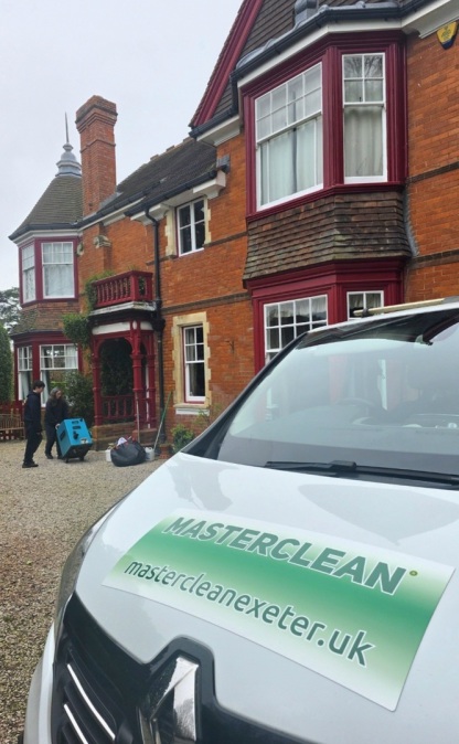 Masterclean carpet cleaning van outside a residential property in Exeter during a professional cleaning appointment