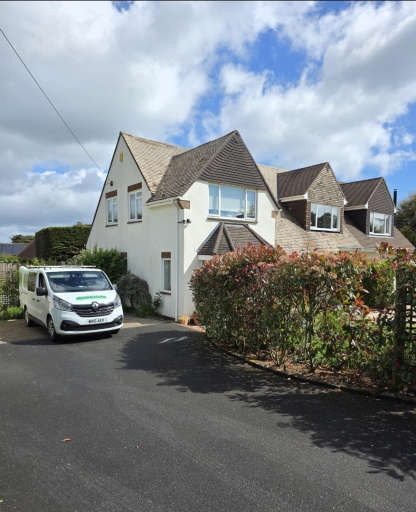 Masterclean carpet cleaning van parked outside a detached property in Budleigh Salterton, East Devon during a professional carpet and upholstery cleaning visit.