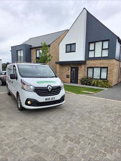 Masterclean carpet and upholstery cleaning van outside a modern home in Devon