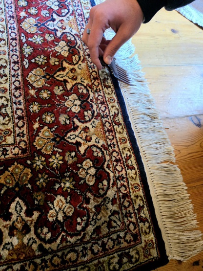 Oriental rug fringe cleaning and grooming in Masterclean's Exeter rug cleaning workshop