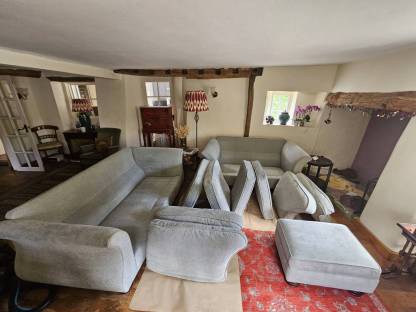 Freshly cleaned fabric sofas and footstool in a period cottage in Whimple near Exeter by Masterclean® upholstery cleaning specialists.
